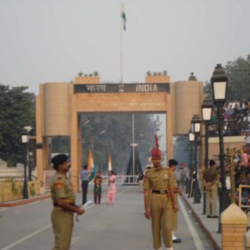 Girls preparing to run up to the border with the Indian flag Girls preparing to run with the Indian flag